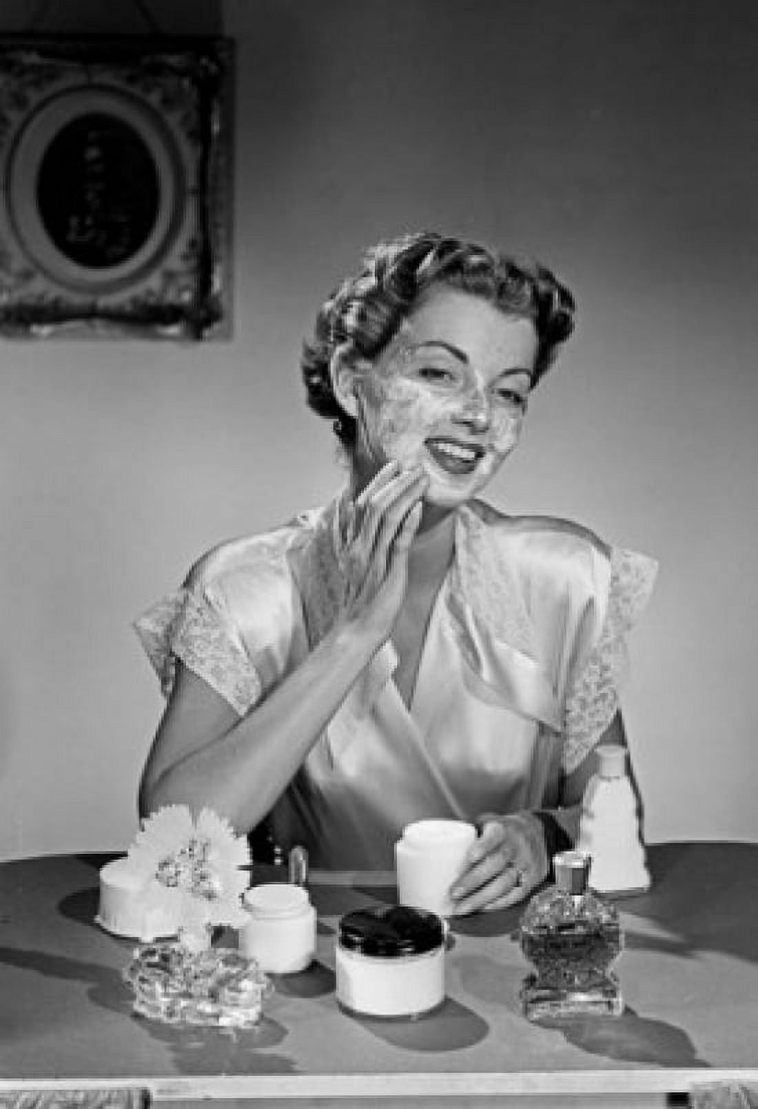 Woman applying face cream Canvas Art - (18 x 24)