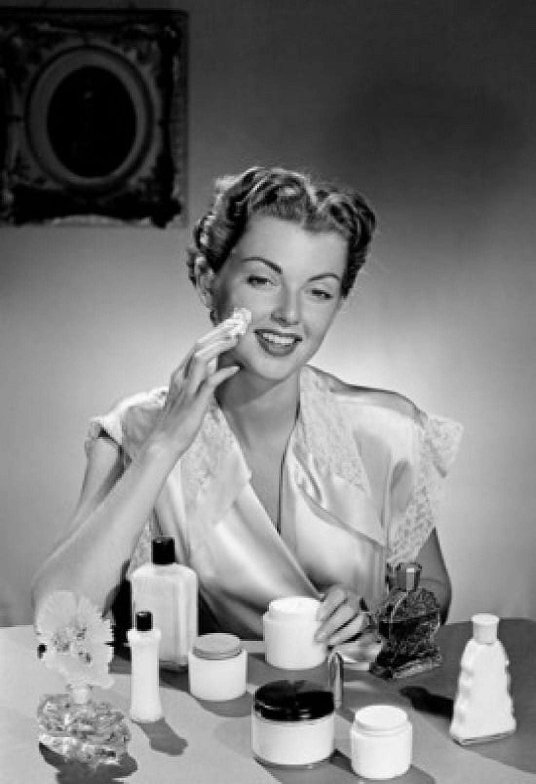 Woman applying face cream Canvas Art -  (18 x 24)