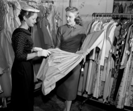 Woman choosing dress in shop Canvas Art - (24 x 36)