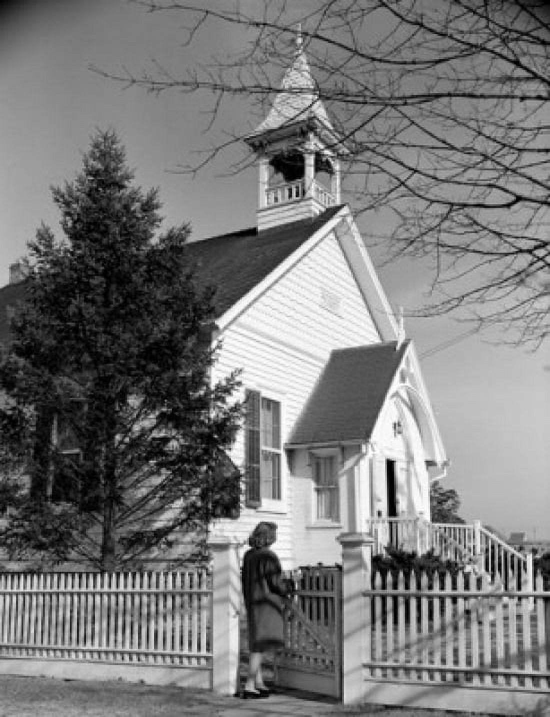 Woman entering gate to church Canvas Art - (24 x 36)