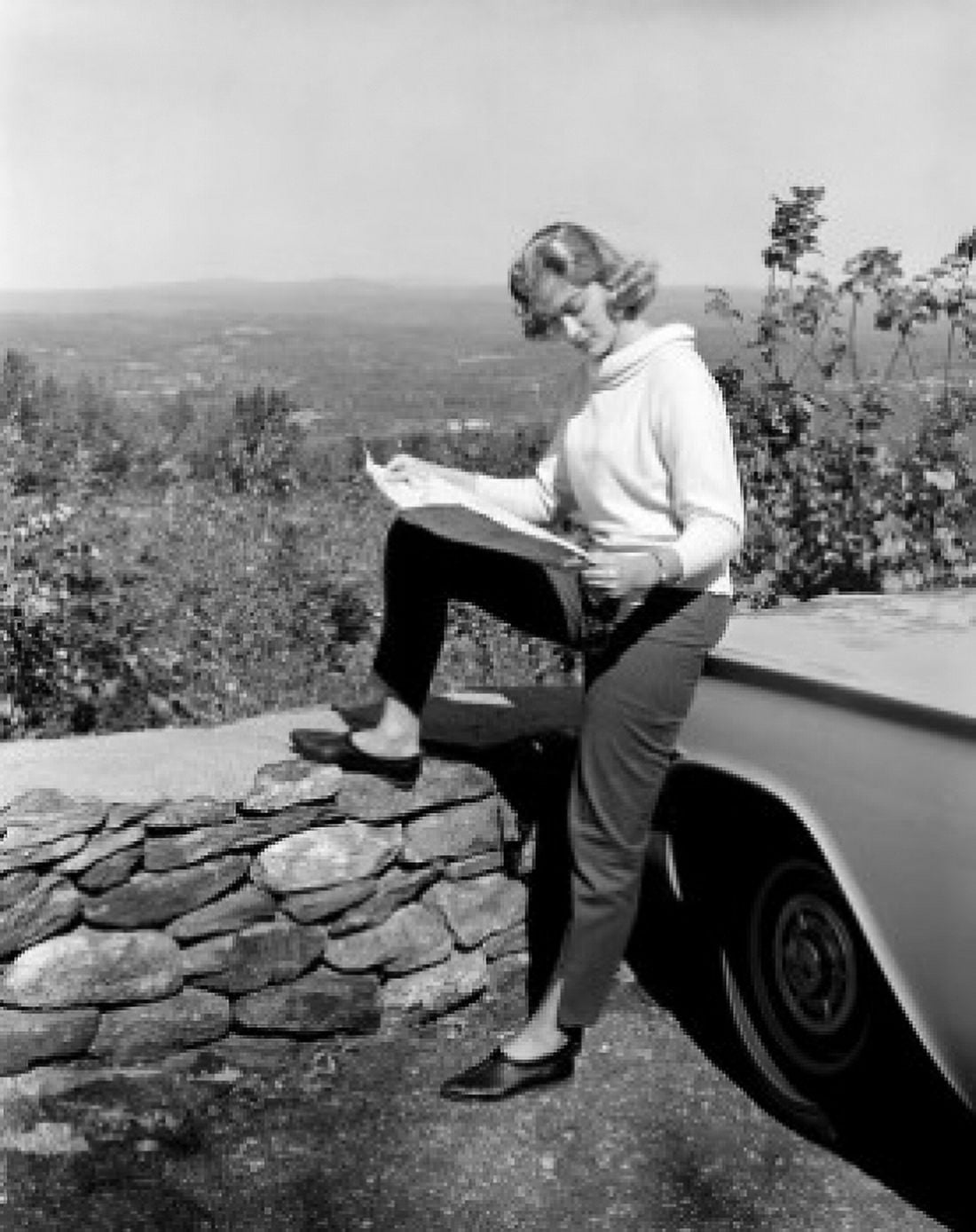 Woman examining map during road trip Canvas Art - (18 x 24)