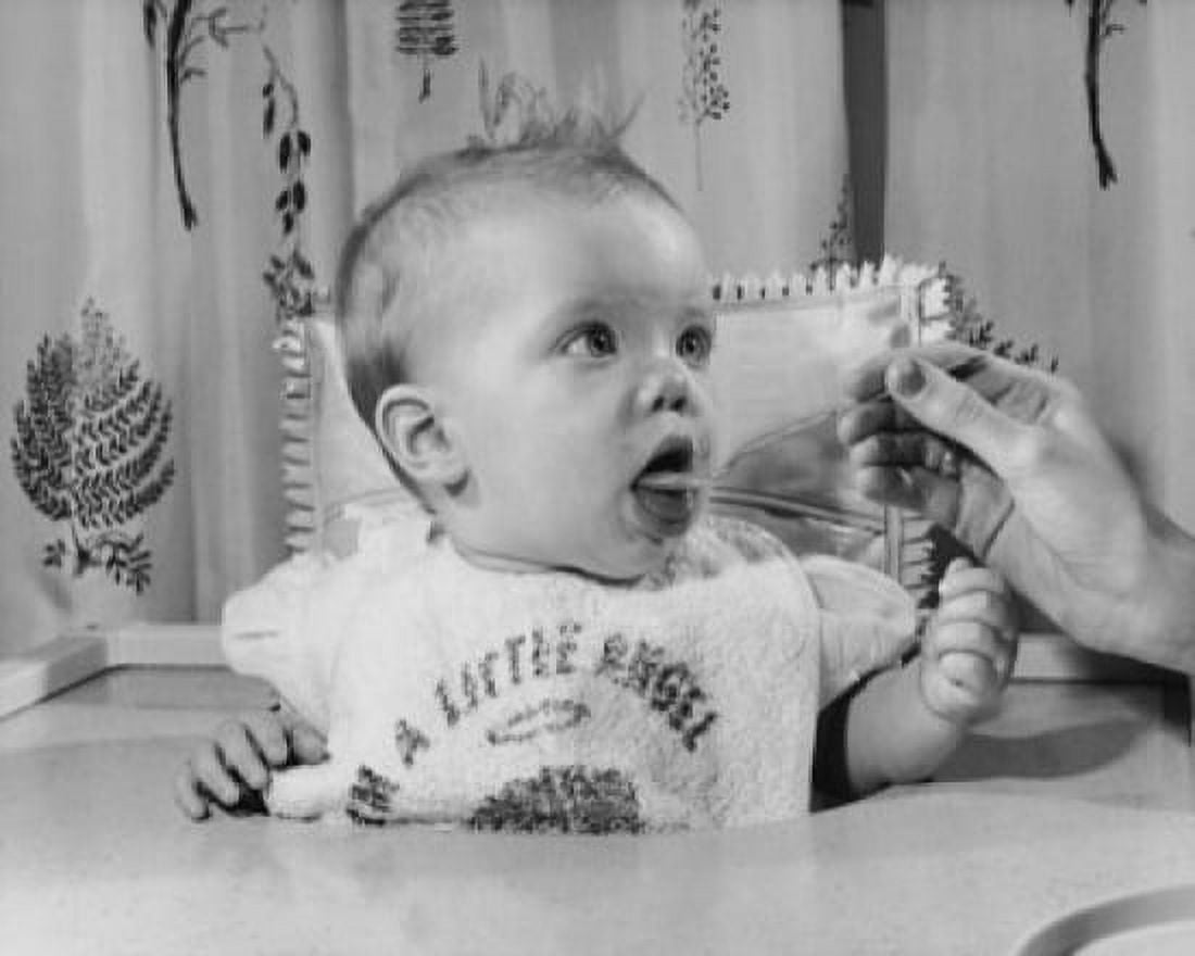 Woman feeding a baby Canvas Art - (24 x 36)
