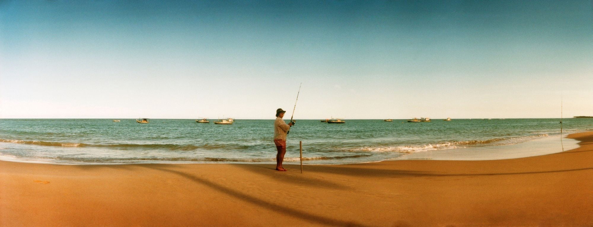 Woman fishing on the beach Morro De Sao Paulo Tinhare Cairu Bahia Brazil Canvas Art - Panoramic Images (27 x 9)