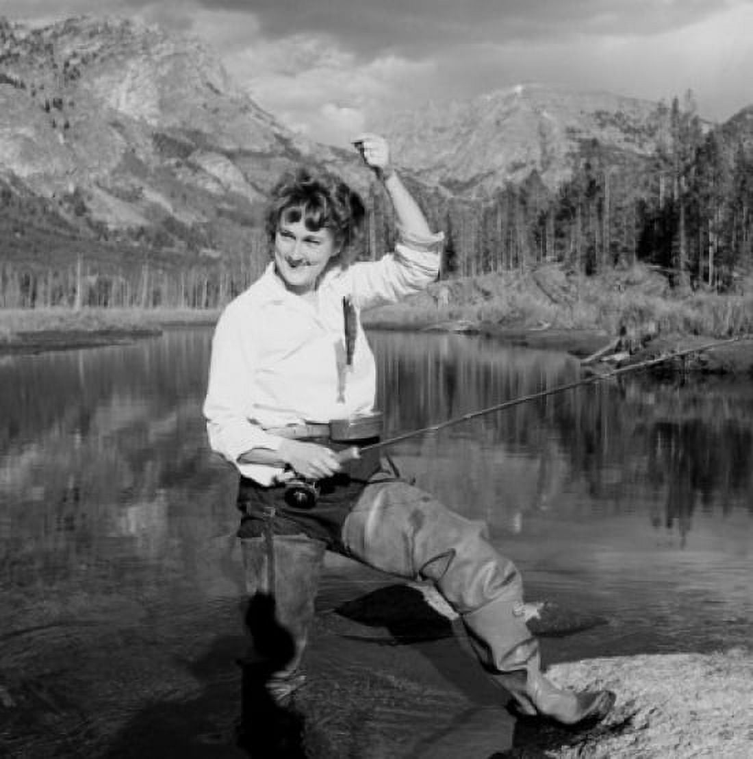 Woman fly fishing in lake Canvas Art - (18 x 24)