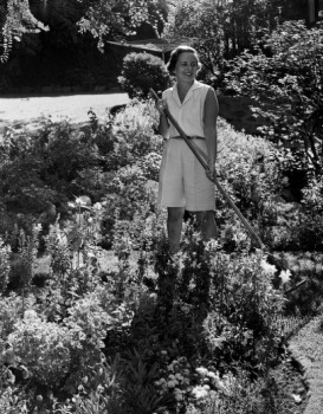 Woman gardening and looking away Canvas Art - (18 x 24)