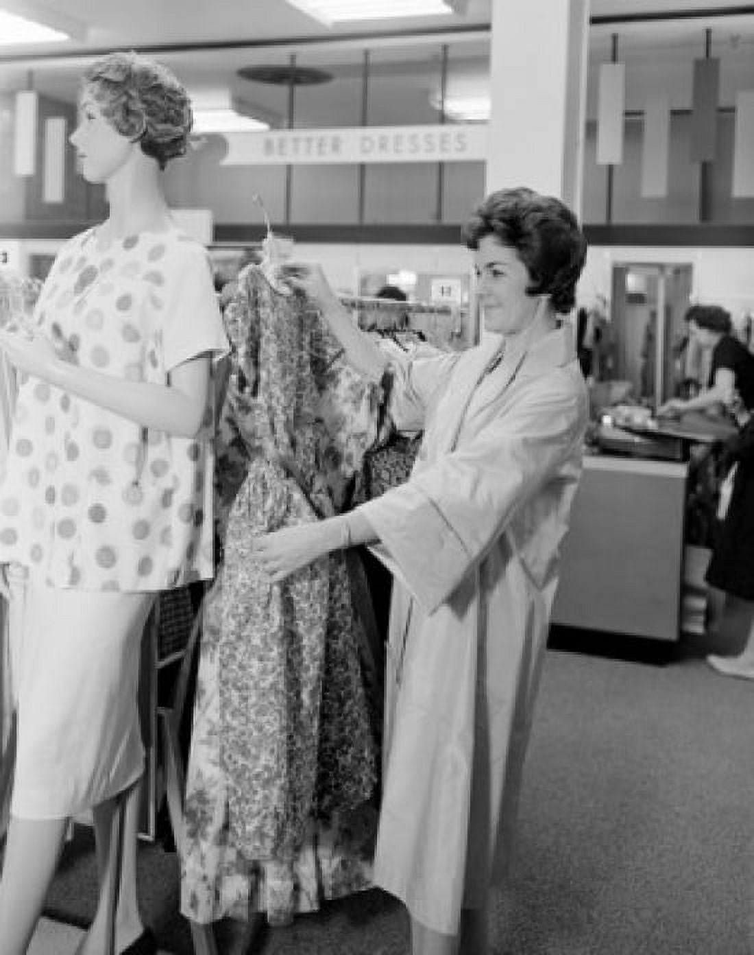 Woman holding dress in clothes shop Canvas Art - (24 x 36)