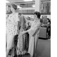 thumbnail image 1 of Woman holding dress in clothes shop Poster Print (18 x 24), 1 of 4