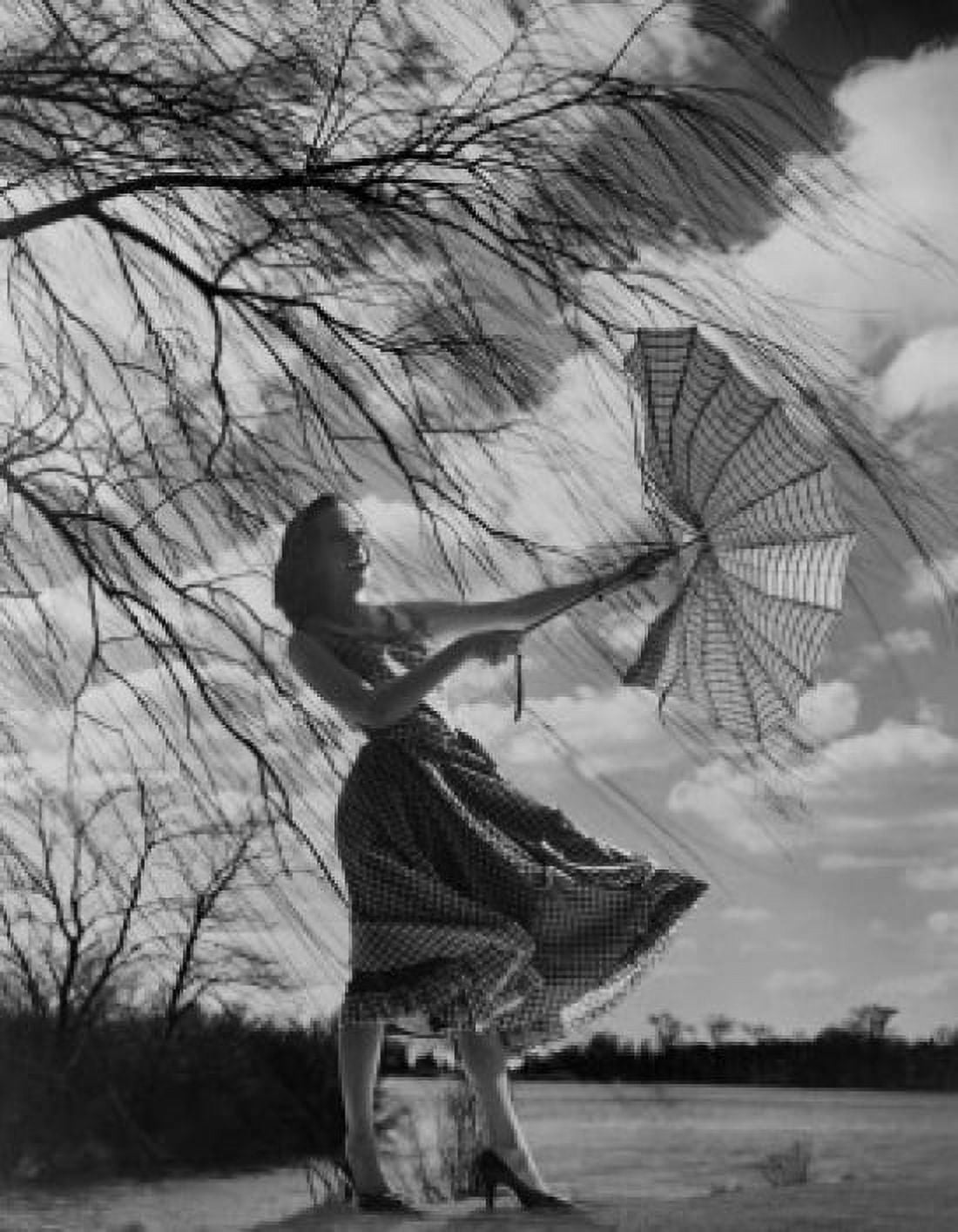 Woman holding umbrella in strong wind Canvas Art - (18 x 24)