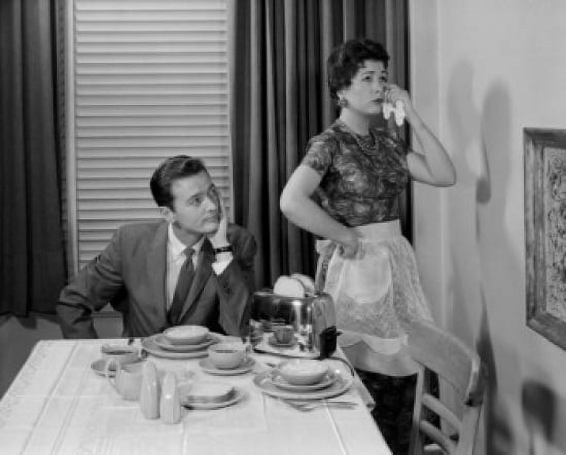 Woman ignoring husband at dining room table Canvas Art - (18 x 24)