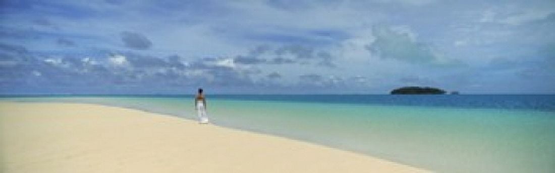 Woman in distance on sandbar Aitutaki Cook Islands Canvas Art - Panoramic Images (18 x 6)