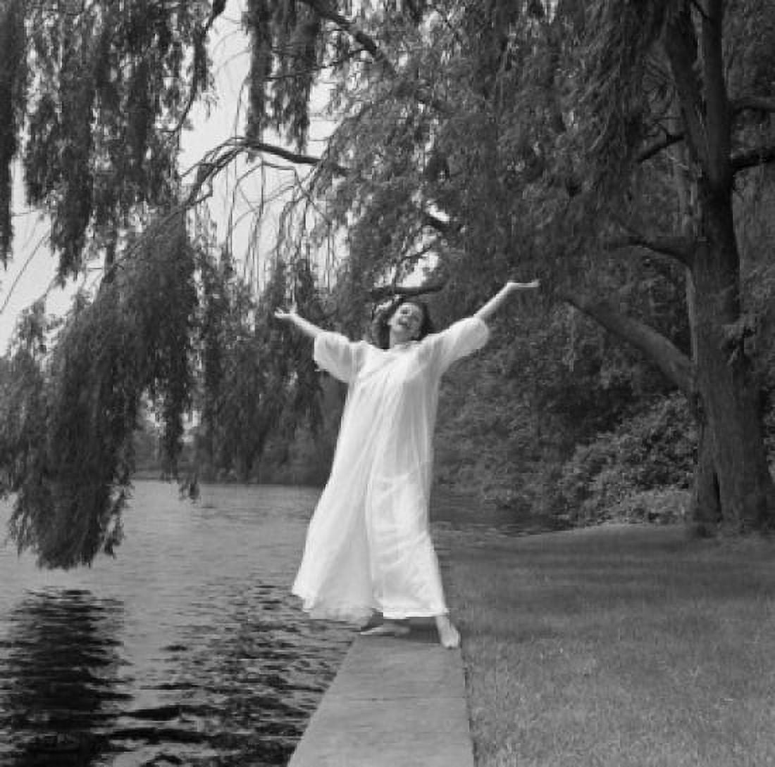 Woman in long dress standing on pool edge Canvas Art - (24 x 36)