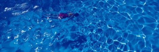 Woman in swimming pool Canvas Art - Panoramic Images (36 x 12)