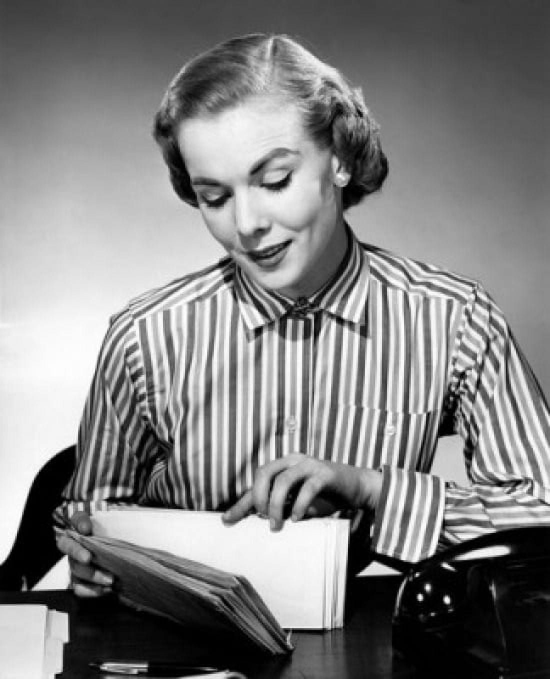 Woman leafing through letters at desk Canvas Art - (24 x 36)