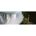 thumbnail image 1 of Woman looking at a rainbow over the Victoria Falls  Zimbabwe Poster Print by  - 36 x 12, 1 of 1