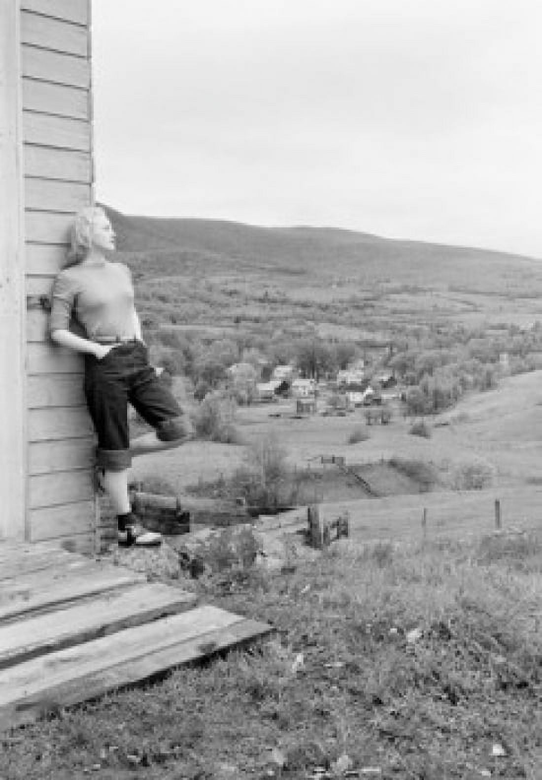 Woman looking at view from house in countryside Canvas Art - (24 x 36)