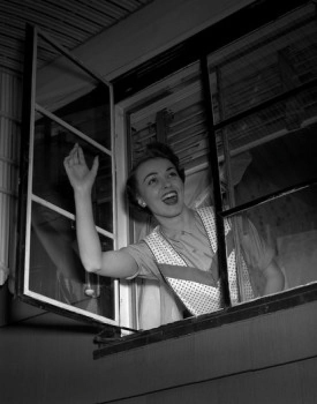 Woman looking through window and waving Canvas Art - (24 x 36)