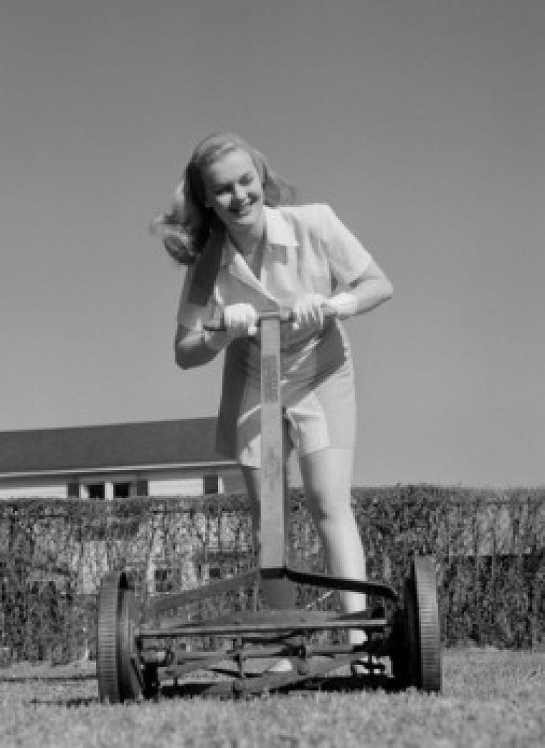 Woman mowing lawn Canvas Art - (24 x 36)