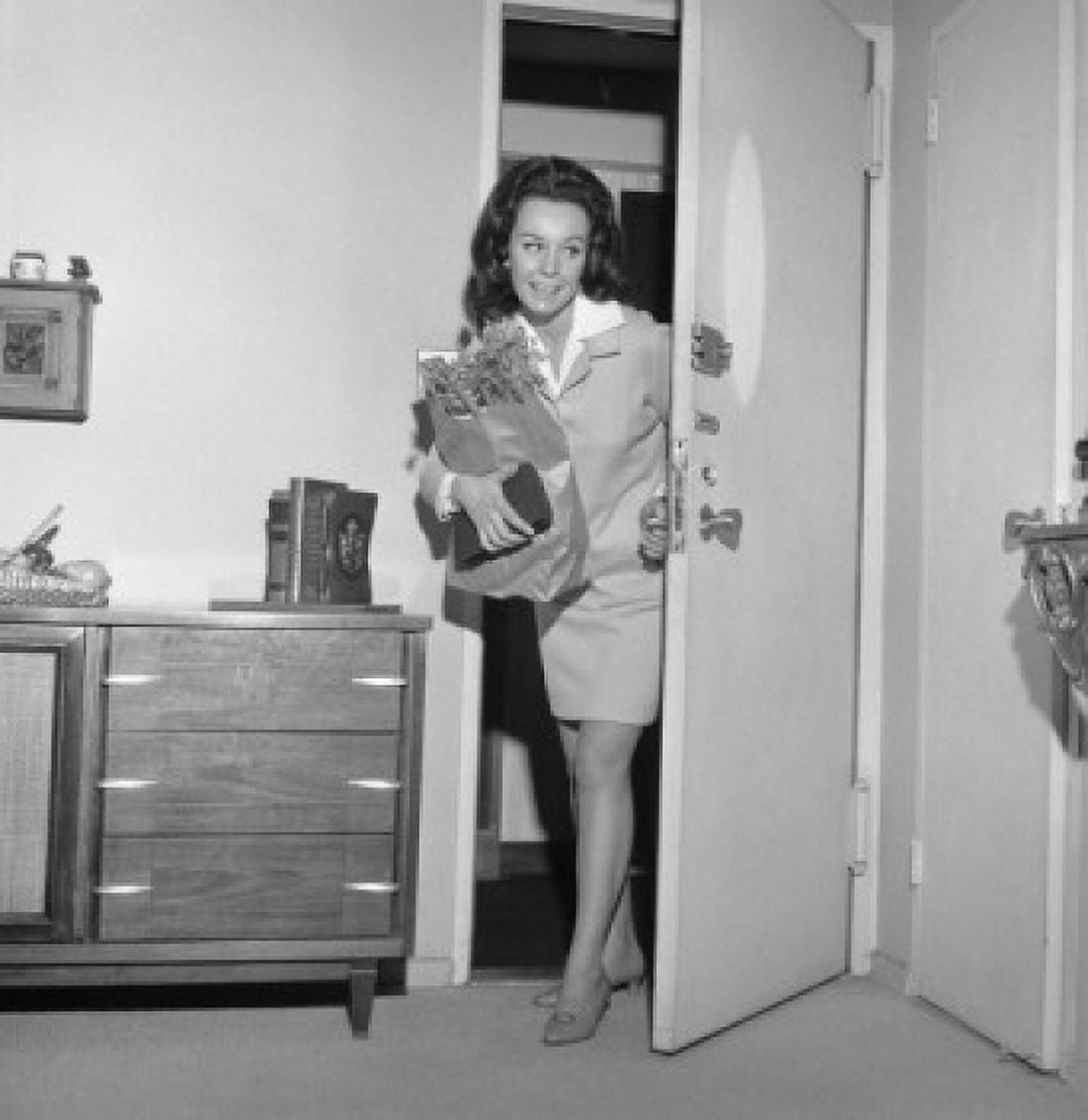Woman opening door Canvas Art - (24 x 36)