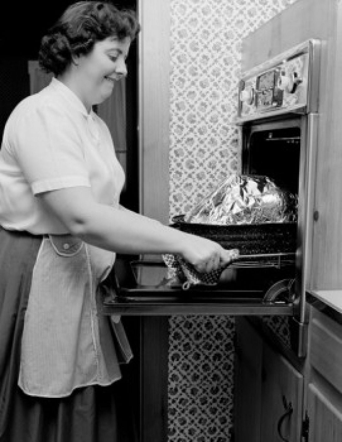 Woman preparing turkey Canvas Art - (18 x 24)