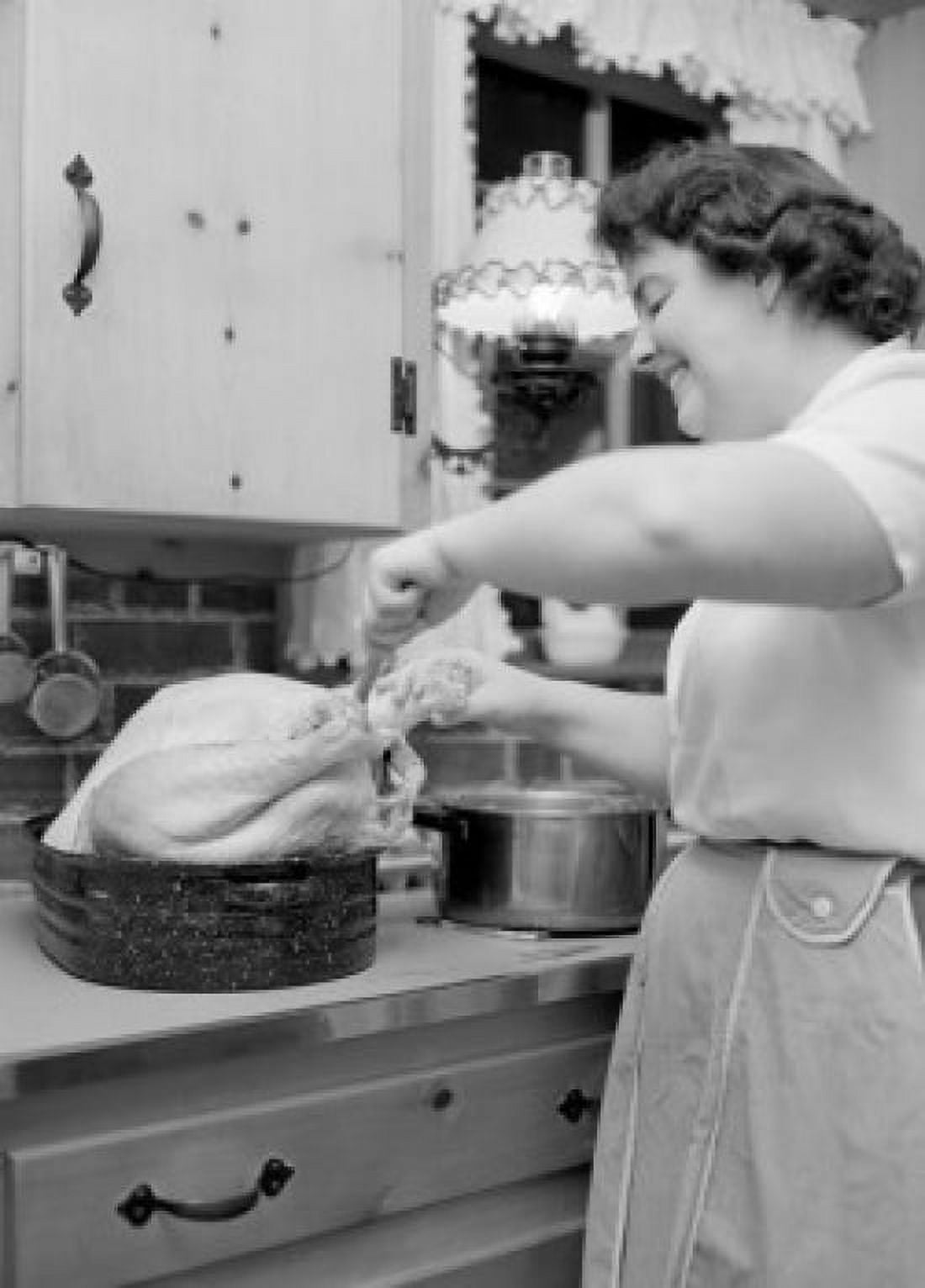 Woman preparing turkey Canvas Art - (18 x 24)