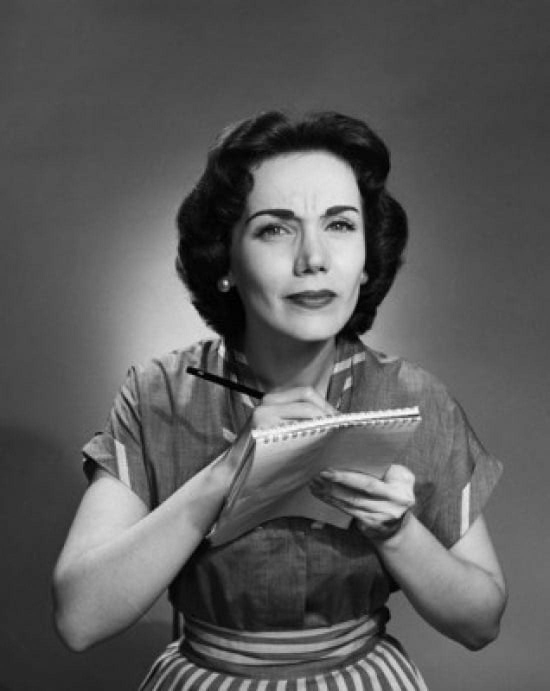 Woman puckering her forehead while doing notes Canvas Art -  (18 x 24)