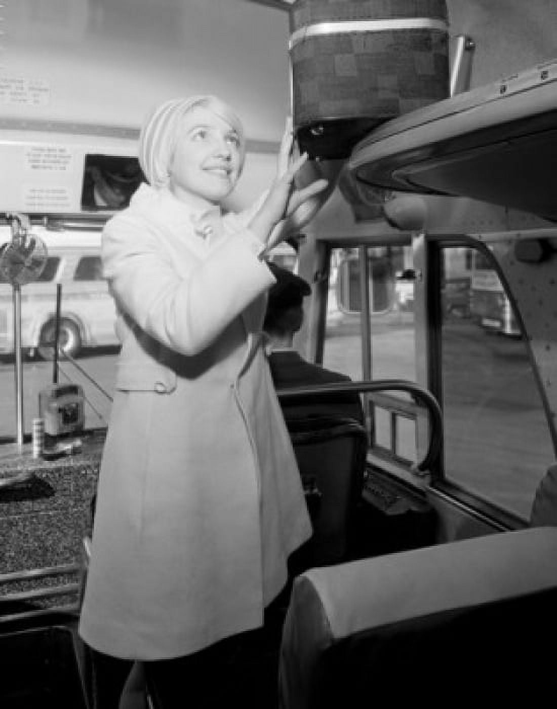 Woman putting luggage in bus Canvas Art - (18 x 24)