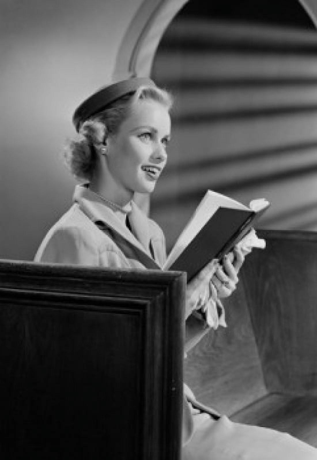 Woman reading bible in church Canvas Art - (18 x 24)