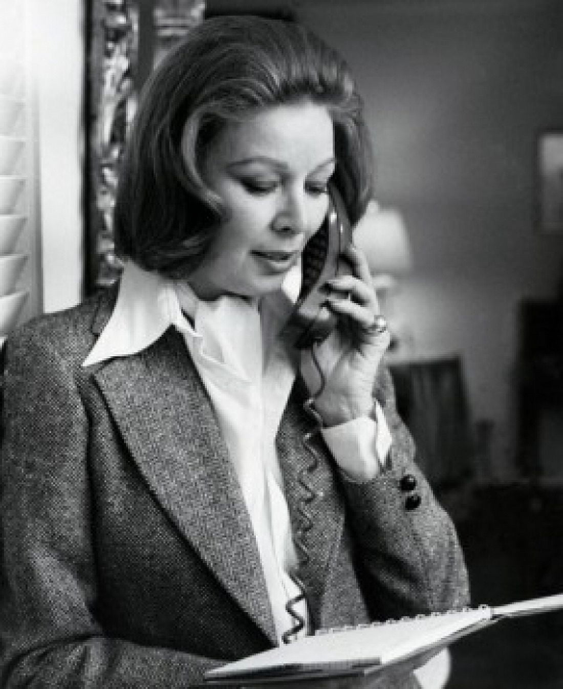 Woman reading document and talking on phone Canvas Art - (24 x 36)
