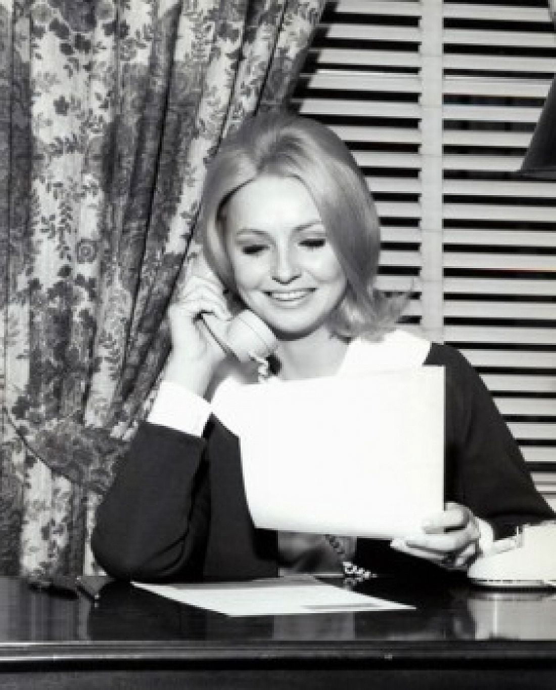 Woman reading document and talking on phone Canvas Art - (24 x 36)