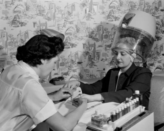 Woman receiving manicure in hair salon Canvas Art - (18 x 24)