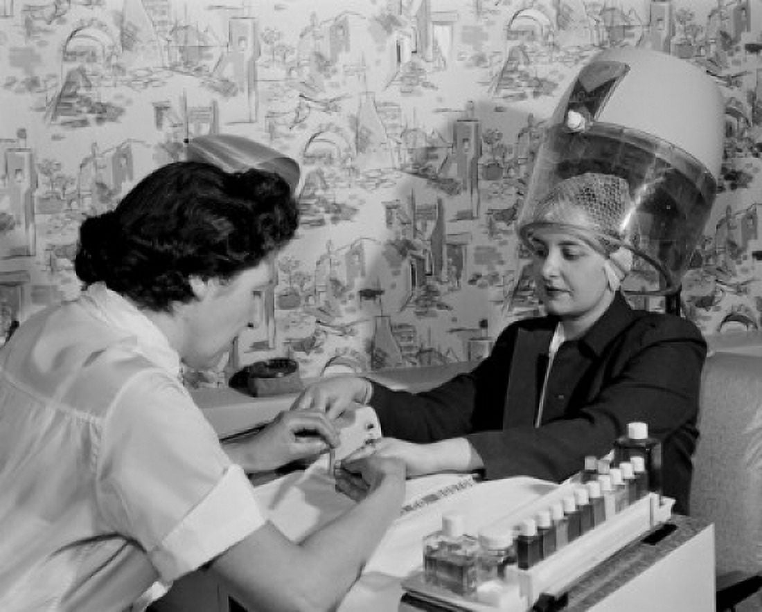 Woman receiving manicure in hair salon Canvas Art - (24 x 36)