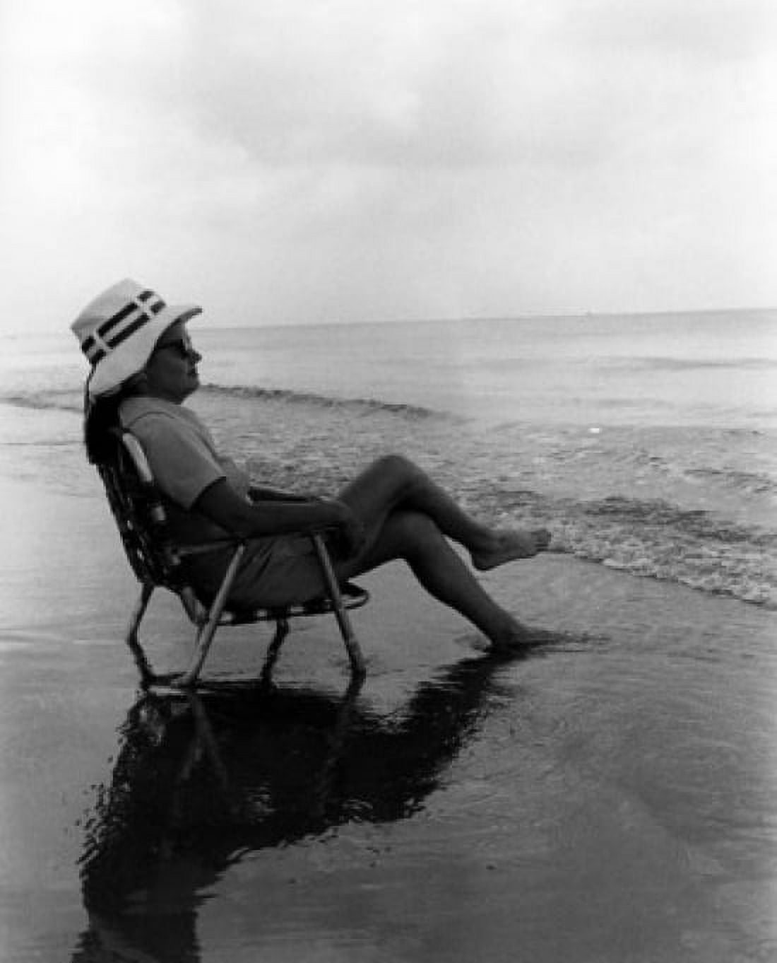 Woman relaxing on chair on beach Canvas Art - (18 x 24)