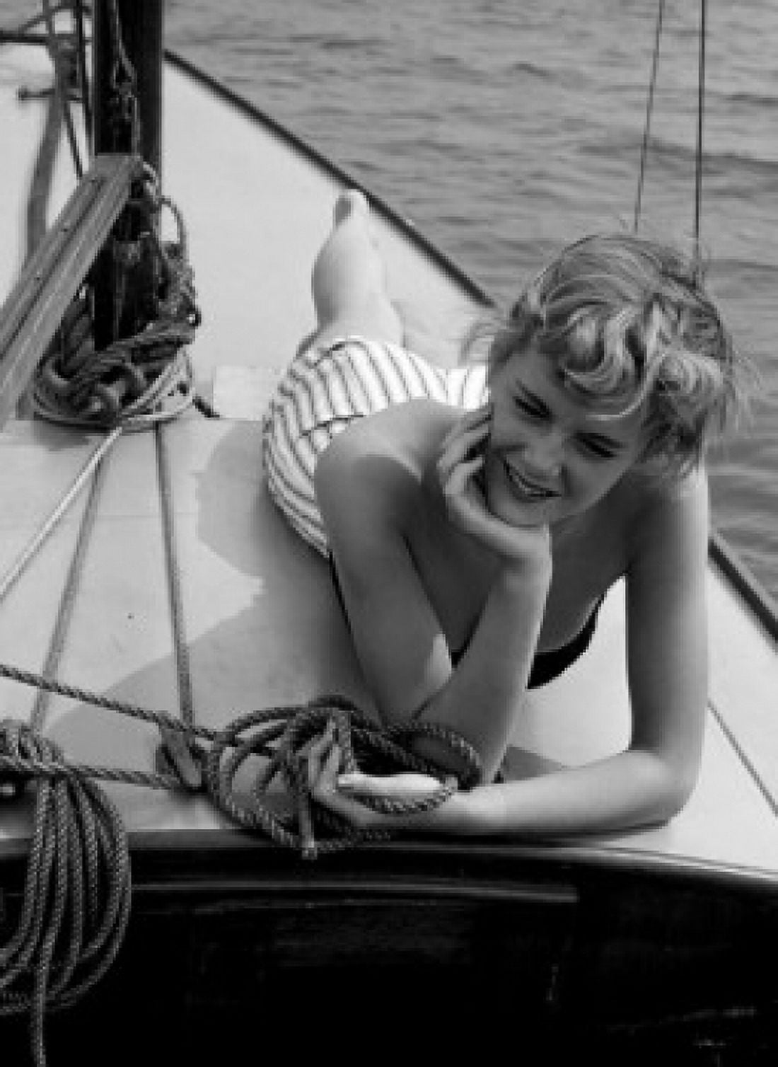 Woman relaxing on deck of boat Canvas Art - (18 x 24)
