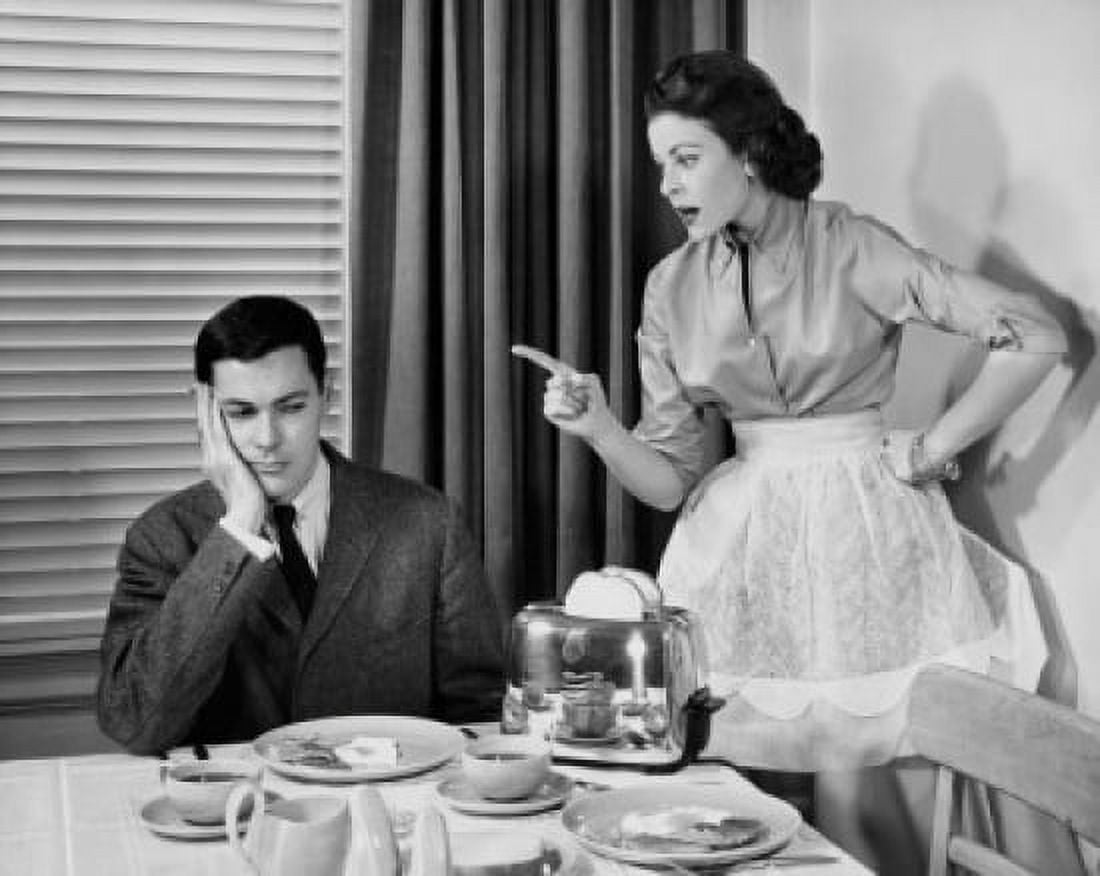 Woman scolding man at dining table Canvas Art - (18 x 24)