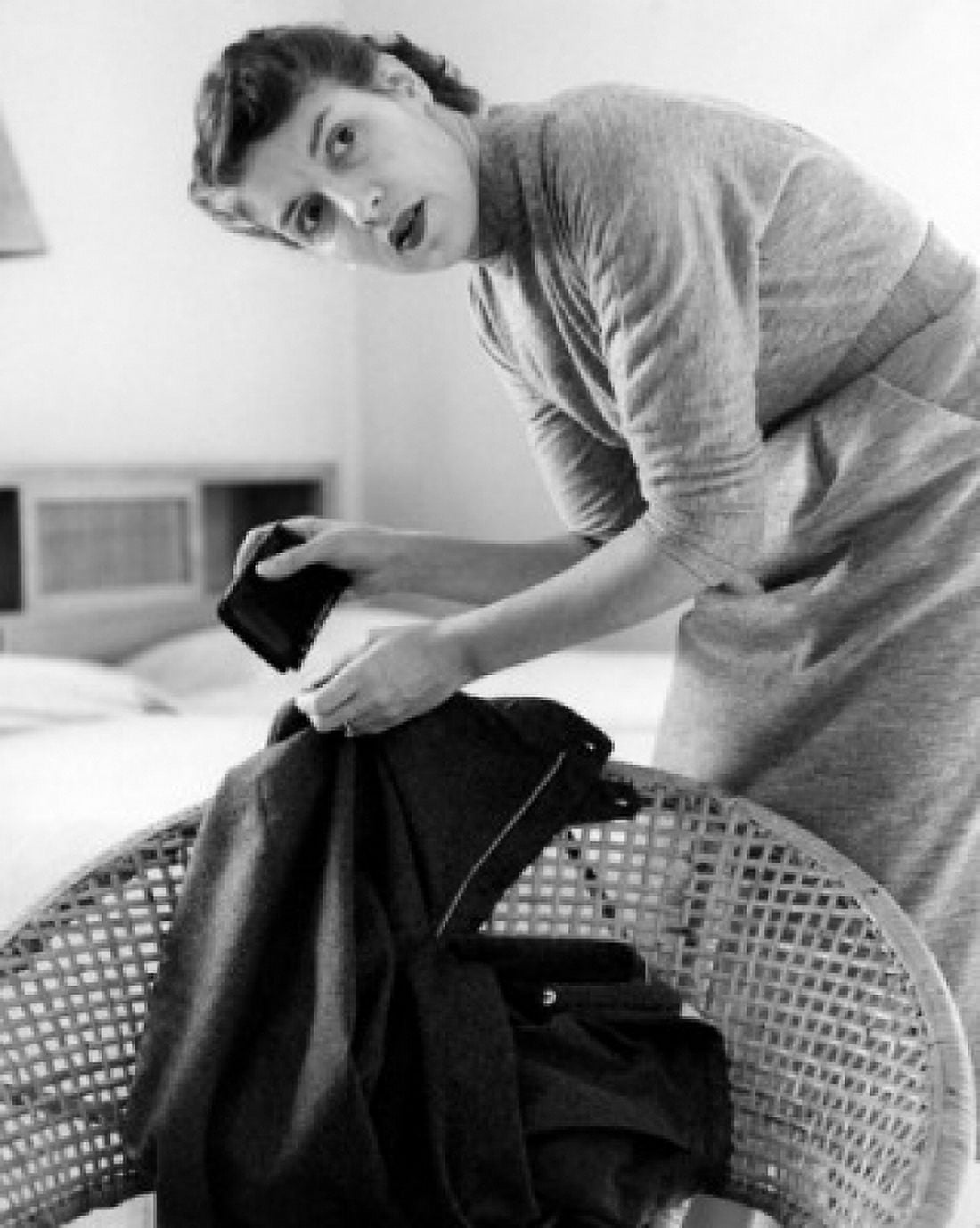 Woman searching for wallet in jacket Canvas Art - (24 x 36)
