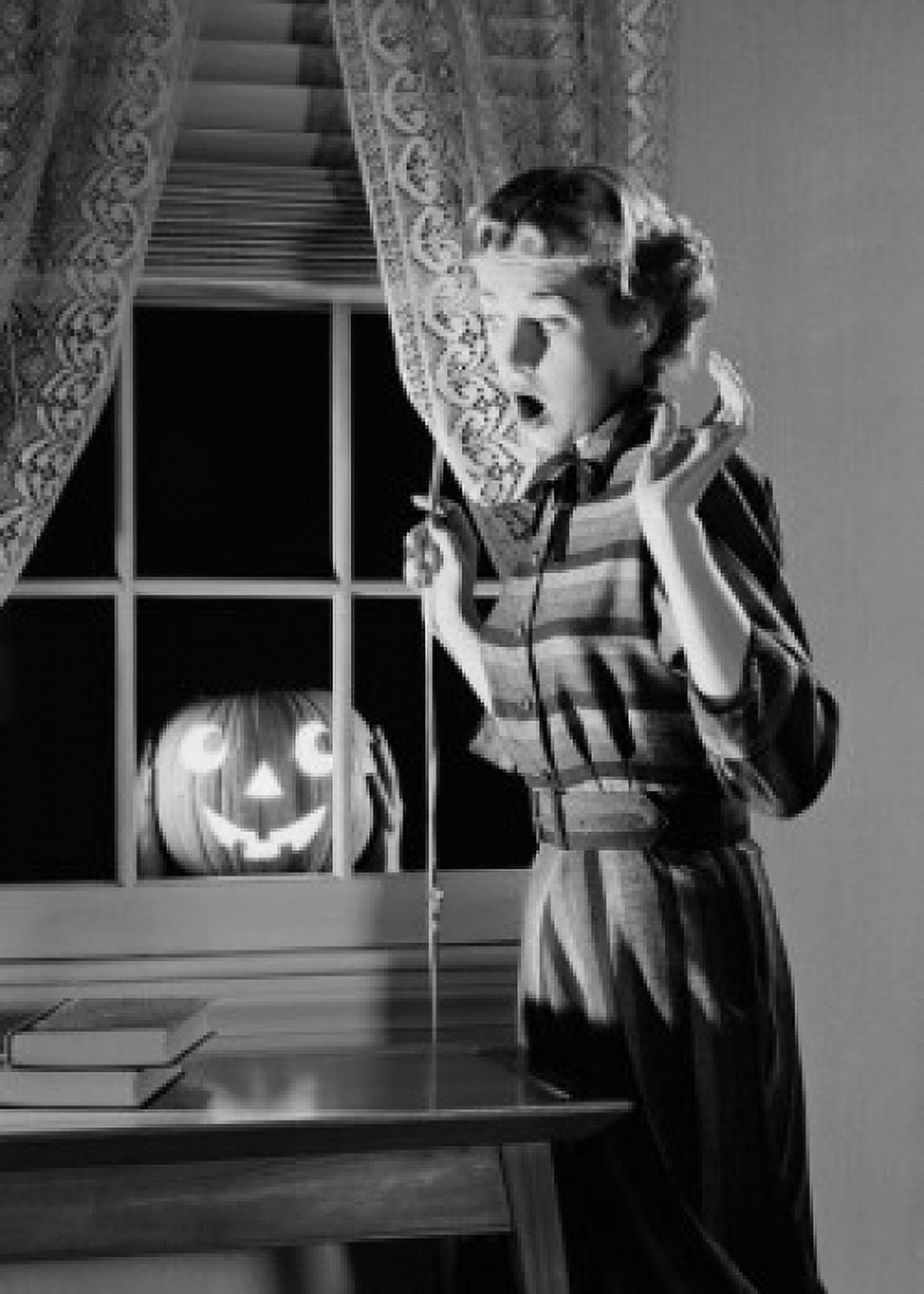 Woman shocked by jack o lantern in window Canvas Art - (18 x 24)