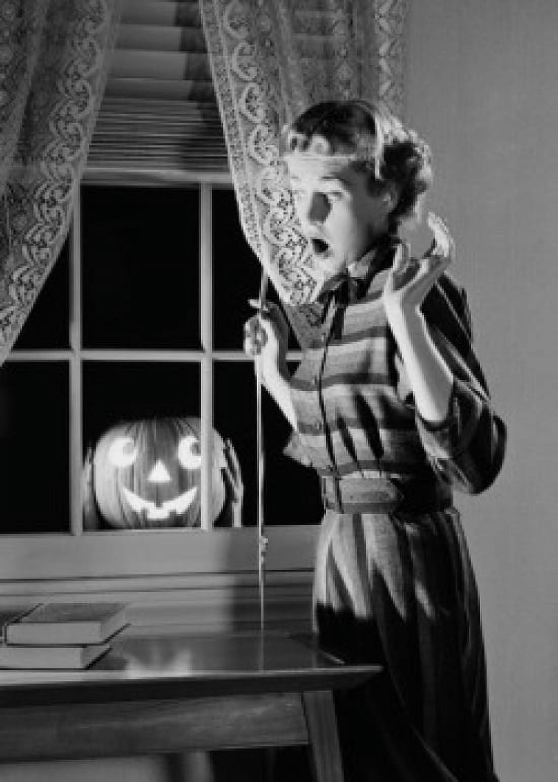 Woman shocked by jack o lantern in window Canvas Art - (24 x 36)