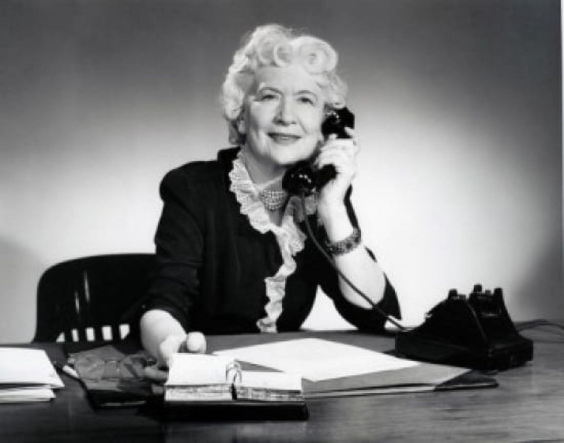 Woman sitting at desk talking on phone Canvas Art - (18 x 24)