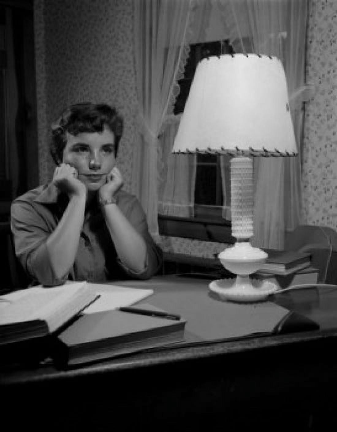 Woman sitting by desk with hands on chins Canvas Art - (24 x 36)