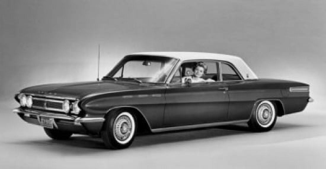 Woman sitting in a 1961 Buick Skylark Sports Coupe Canvas Art - (18 x 24)