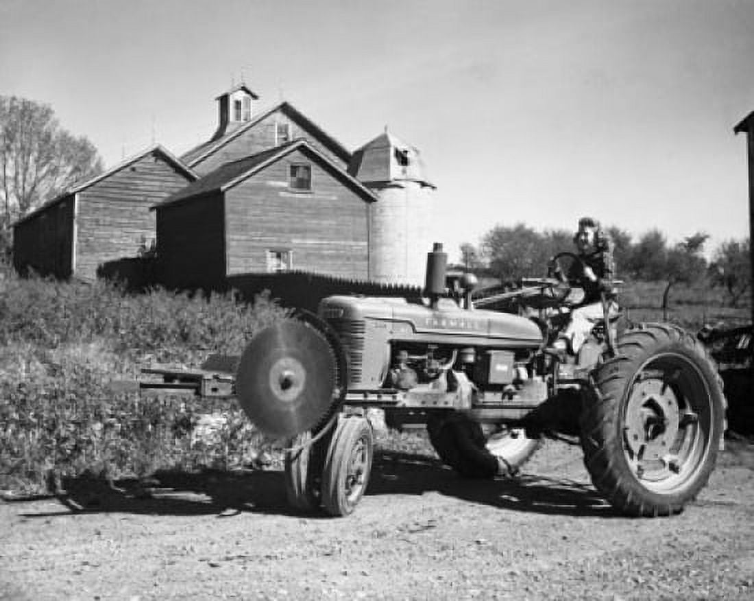 Woman sitting on a tractor Canvas Art -  (18 x 24)