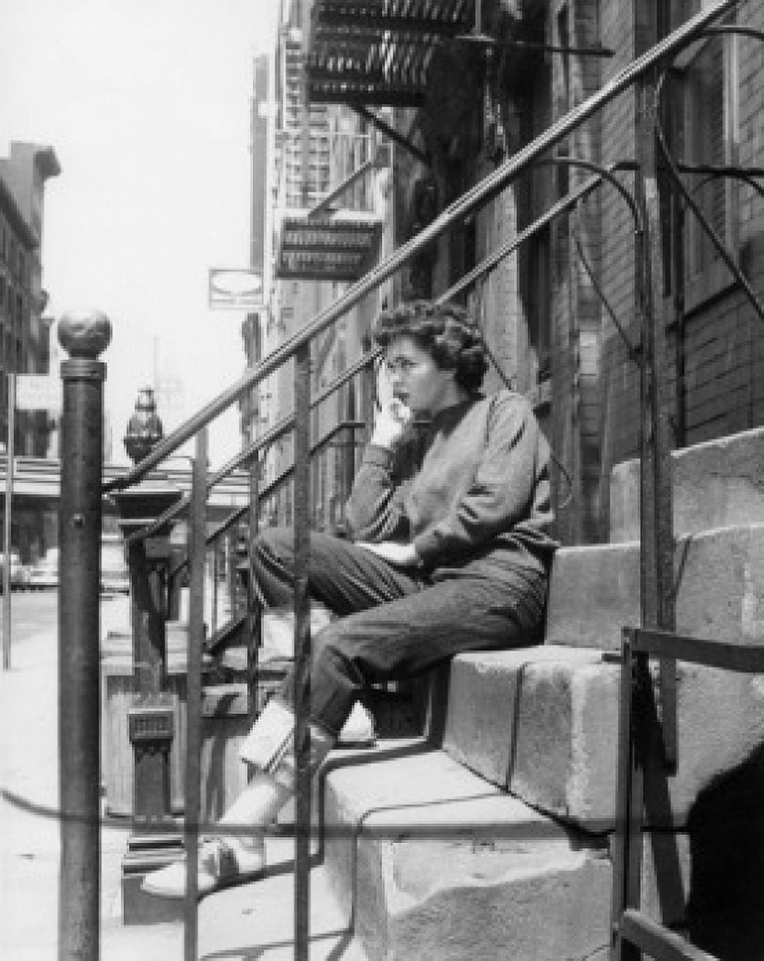 Woman sitting on front stoop Canvas Art - (24 x 36)