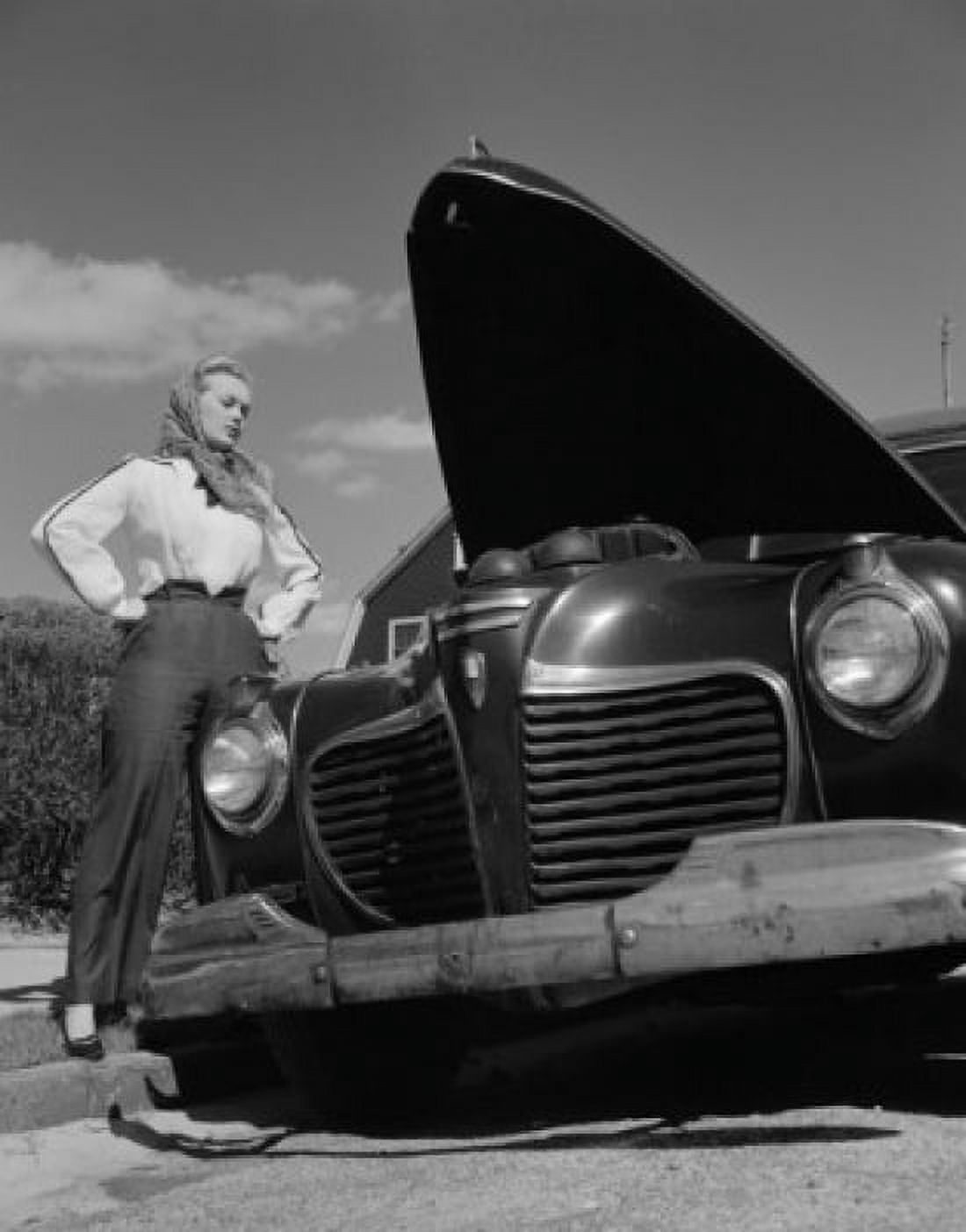 Woman standing by car with open hood Canvas Art - (18 x 24)