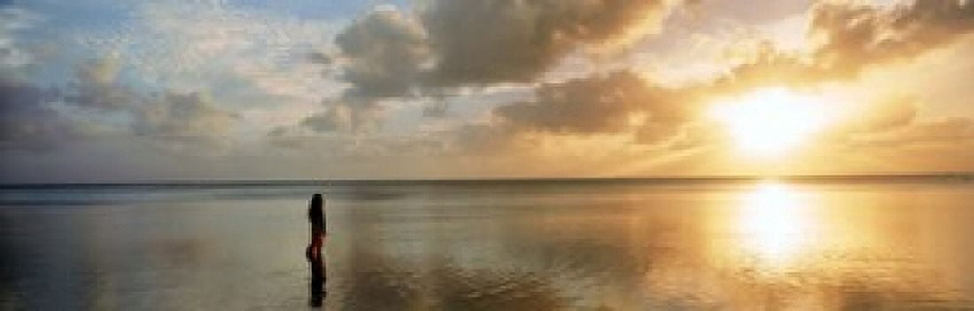 Woman standing on sandbar looking at sunset Aitutaki Cook Islands Canvas Art - Panoramic Images (18 x 6)