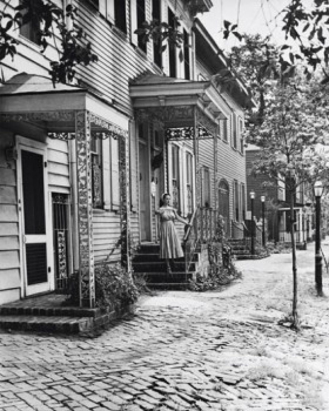 Woman standing on the porch of a house Savannah Georgia USA Canvas Art - (18 x 24)