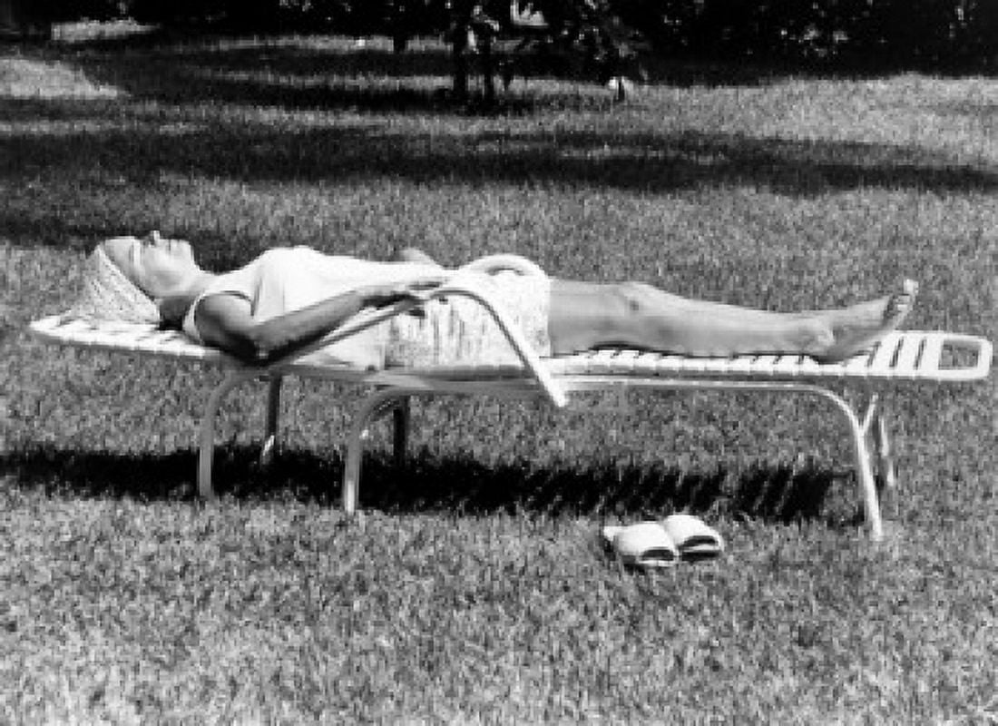 Woman sunbathing in backyard Canvas Art - (18 x 24)