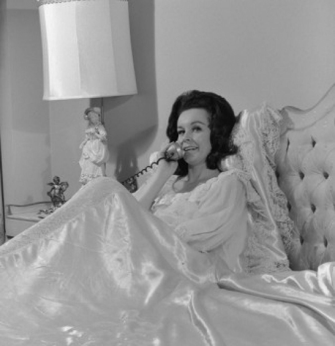 Woman talking on phone in bed Canvas Art -  (18 x 24)