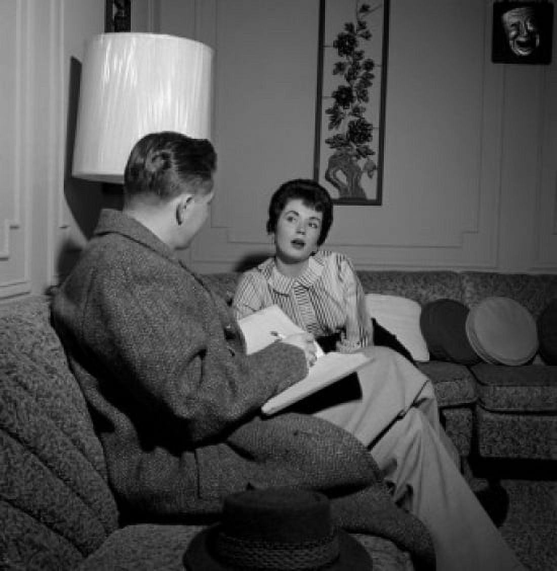 Woman talking with advisor in living room Canvas Art - (18 x 24)