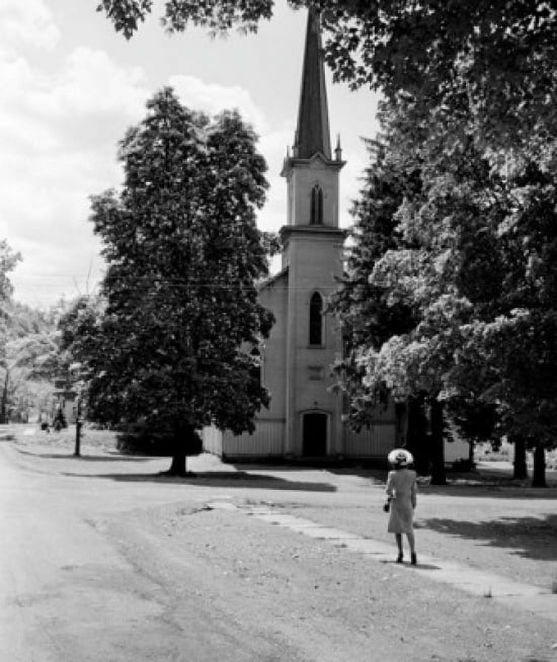 Woman walking to church Canvas Art - (24 x 36)