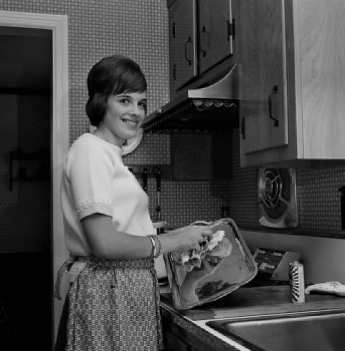 Woman washing dishes and smiling Canvas Art - (24 x 36)